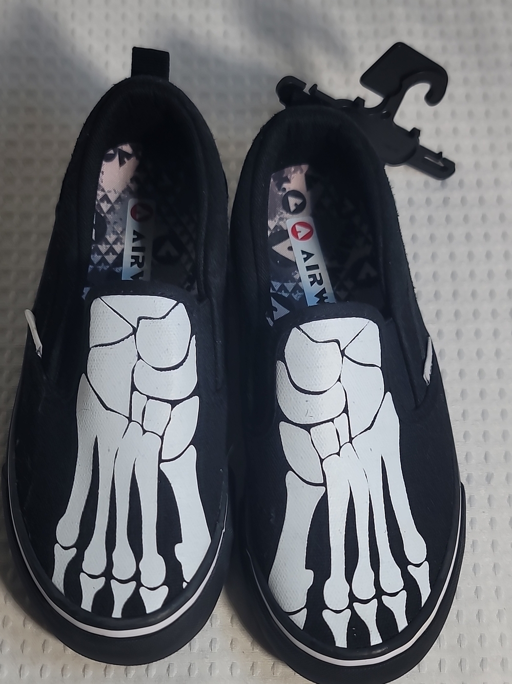 Airwalk Kids Black Slip-On Sneakers with White Skeleton Foot Graphic